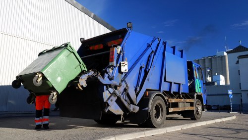 Professional rubbish clearance team at work in Colyers