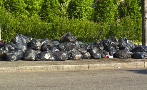 Professional rubbish clearance team at work in a Peckham commercial space