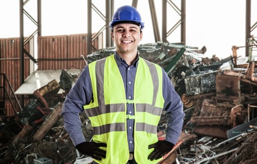 Rubbish Boy staff handling large bins for waste removal